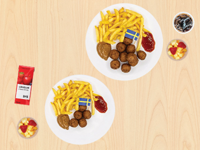 Meatball plates with fries, drinks, and fruit highlighting adult and children's meals.   