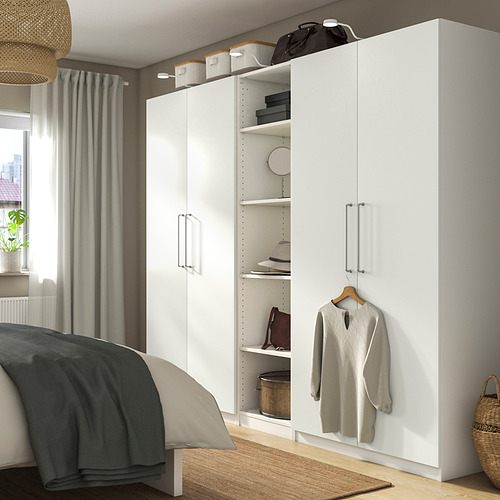 Minimalist white PAX wardrobe; tall, fits beside bed, stores clothes, bags, hats.