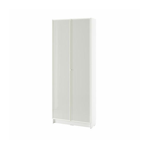Librería blanca BILLY con puertas de vidrio esmerilado, diseño moderno y elegante.