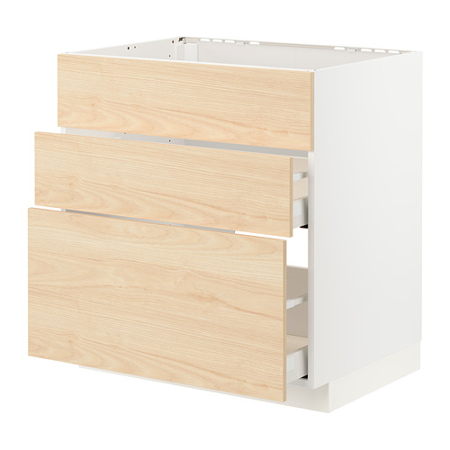 White METOD kitchen cabinet with light ash wood drawers.