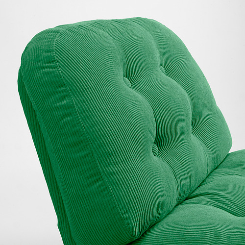 Respaldo de sillón acolchado, afelpado y de color verde brillante. Textura refinada y acogedora, diseño moderno pero vintage.