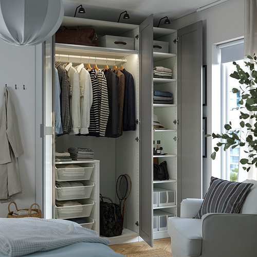 Modern wardrobe with lit clothes storage, polished hanging rails, and organized shelves.