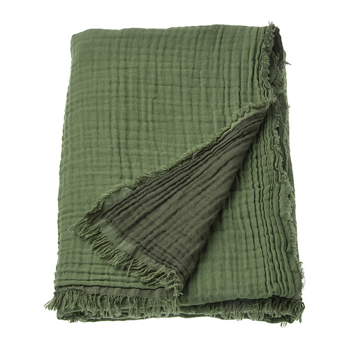 Una manta VALLKRASSING en verde. Confeccionado en algodón suave con textura arrugada y bordes sin rematar.