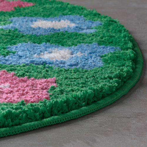 Alfombra de baño redonda y afelpada con borde verde, estampado floral azul y rojo, textura suave, alta calidad.