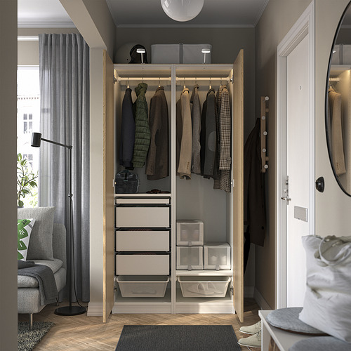 Open wardrobe with clothes, drawers, and shelves. Soft-closing hinges, adjustable feet, and integrated lighting.