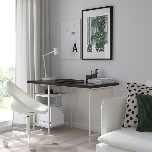 Modern home office with LAGKAPTEN desk, chair, and colorful sofa.
