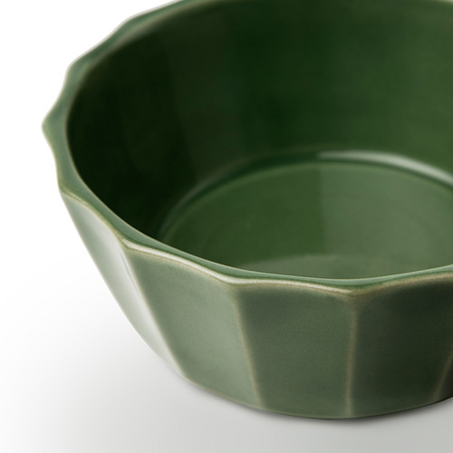 Cuenco verde con diseño de hojas.