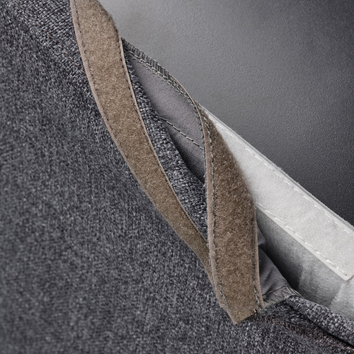 Bolsillo de tela gris sobre funda de silla extraíble, fácil de limpiar.