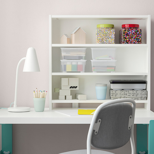 A PÅHL top shelf, light & simple, matches desk, holds items.