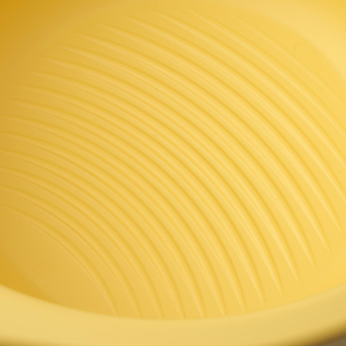 Yellow folding wash-tub with ridged bottom, stored flat.