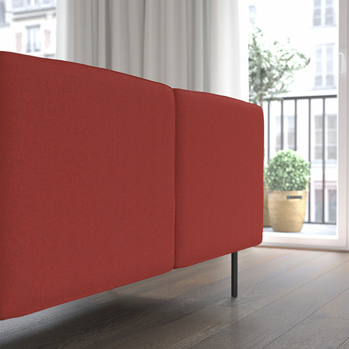 Bright red LILLEHEM sofa with wooden floor and potted plant nearby.
