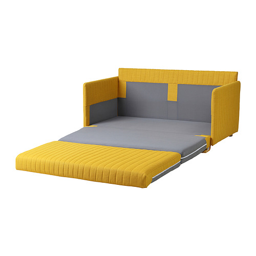 Un sofá cama FRIDHULT amarillo con colchón gris, apto para espacios reducidos.