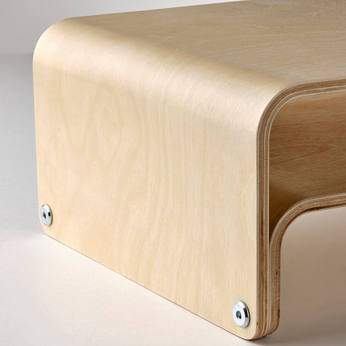 Modern wooden desk with rounded edges and metal screws, showcasing quality craftsmanship.