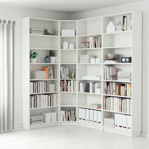 White corner bookshelf with books, decor, and plants. Shelves adjustable and wall-anchored.