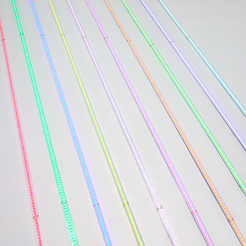 Colorful led light strips with usb connectors, displaying multiple colors and patterns, arranged diagonally on a light background.