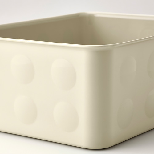Caja de almacenamiento de plástico de color blanquecino con círculos texturizados en relieve. Robusto para organizar artículos.