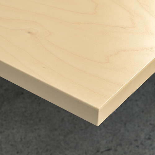 Primer plano de los escritorios mitchell, superficie de madera lisa y de color claro, que muestra una textura de grano fino y bordes limpios.