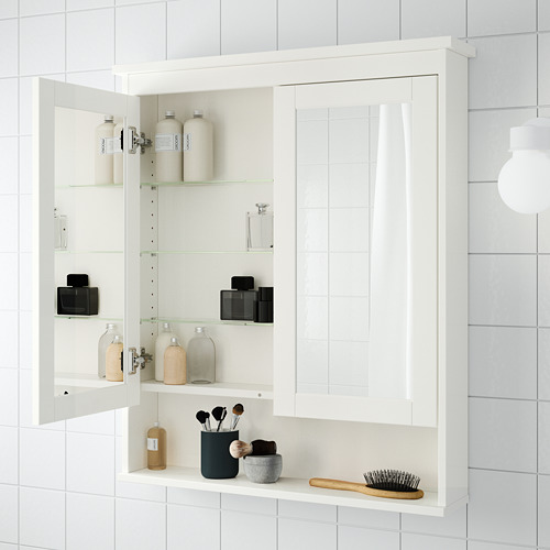 Armario blanco con espejo de baño montado en la pared con estantes de vidrio ajustables, para guardar artículos de tocador y maquillaje.