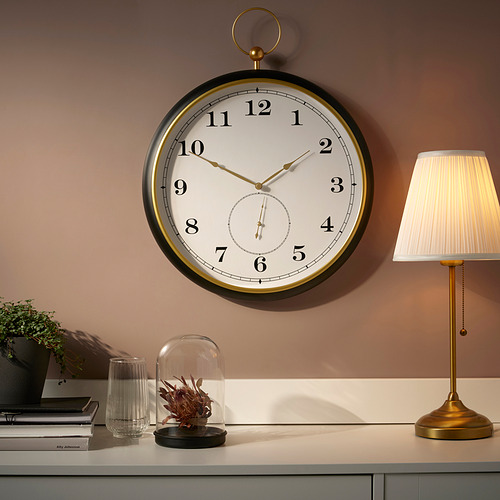 Reloj de pared estilo reloj de bolsillo vintage con detalles en negro y oro, movimiento de cuarzo silencioso.