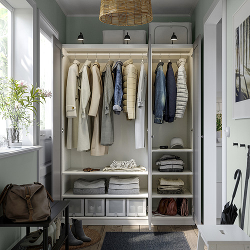 Modern open closet with hanging coats, folded clothes, and shelves. Has integrated lighting and adjustable feet.