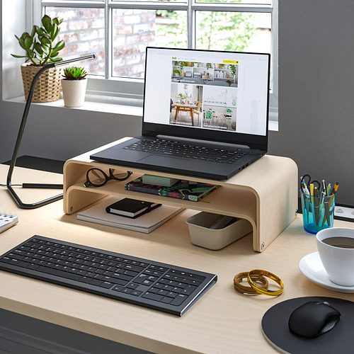 Organized workspace with VATTENKAR wooden laptop stand, keyboard, mouse, coffee, desk accessories, and plants.