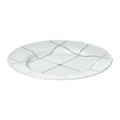 Plato de porcelana blanca UPPLAGA, redondo con borde ondulado, diseño de líneas discontinuas negras.