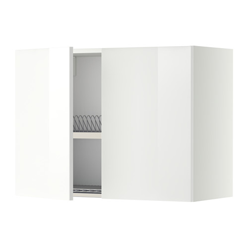 Un armario de cocina METOD blanco con una puerta abierta, que revela un escurridor de platos en el interior.