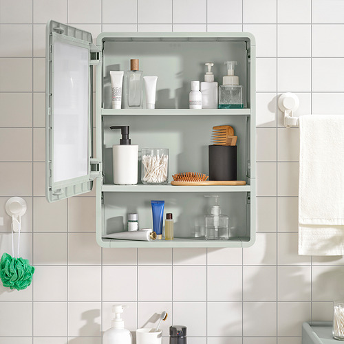 Mueble de baño verde con espejo, almacenamiento abierto y cerrado, montado en la pared.