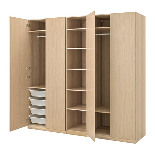 Light wood PAX wardrobe with shelves, hanging rails, and mesh baskets.