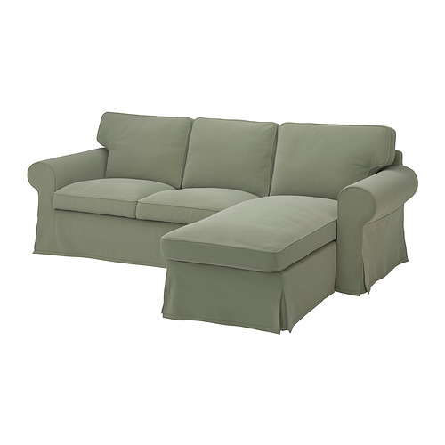 Sage green l-shaped sectional sofa, rolled arms, comfy cushions.