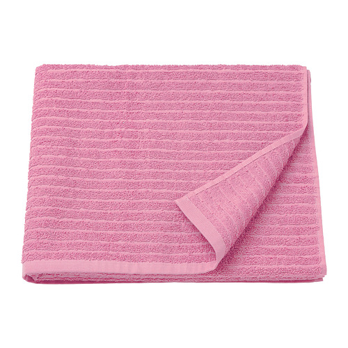 Una toalla VÅGSJÖN doblada de color rosa brillante hecha de 100% algodón, con un diseño texturizado.