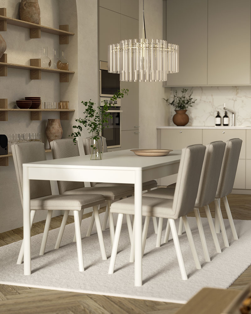 An o-white TONSTAD table with six chairs is on a rug and below a glass chandelier, by an open kitchen with modern fronts.