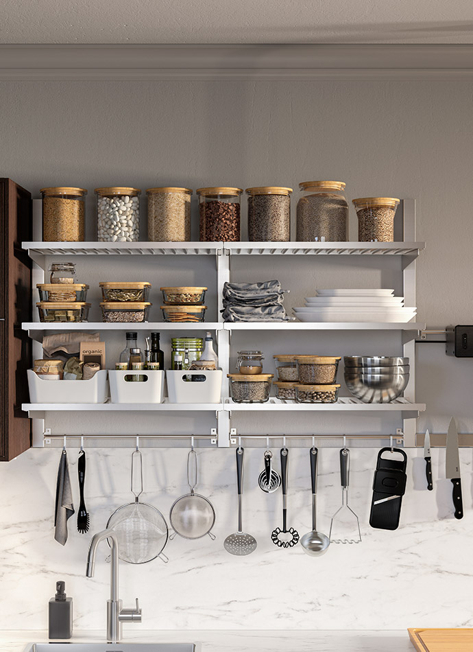 Organized kitchen with white shelves full of jars and hanging utensils, above a marble backsplash.