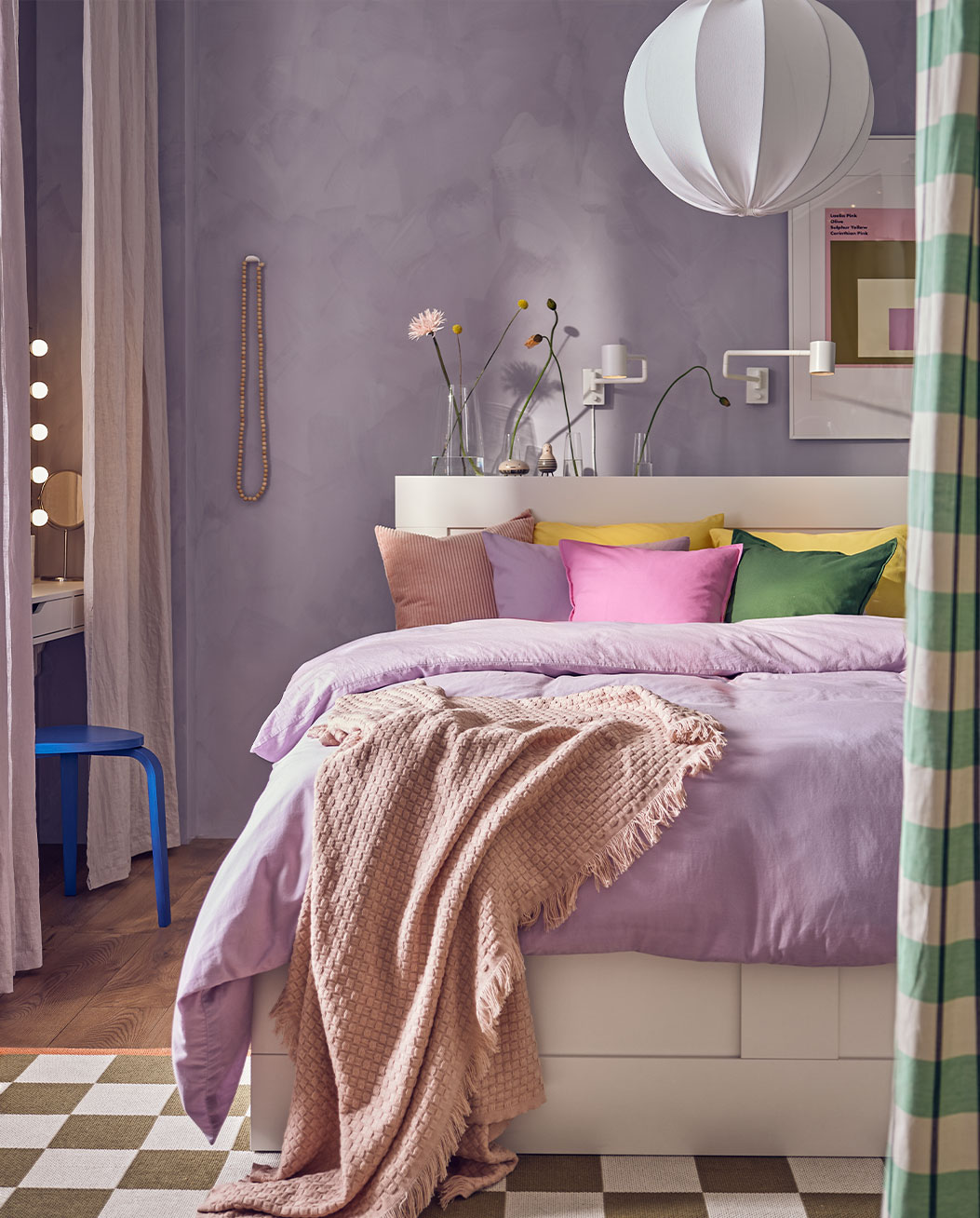 Colorful bedroom, a large bed with brightly colored cushions