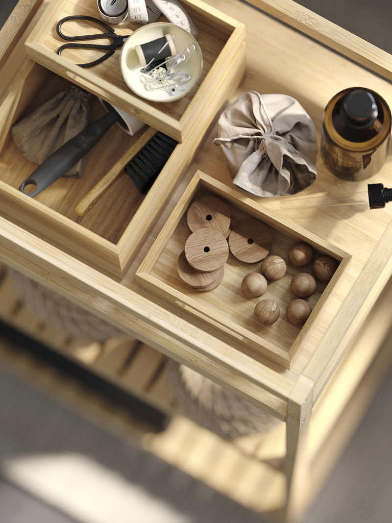 DRAGAN bamboo boxes with small essentials displayed on a RÅGRUND bamboo shelving unit.
