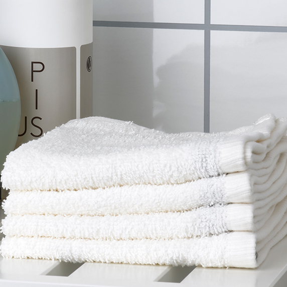 Stack of four medium white towels