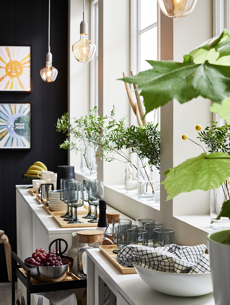 A practical space with plenty of storage and a flat surface to place and prepare your trays before serving.