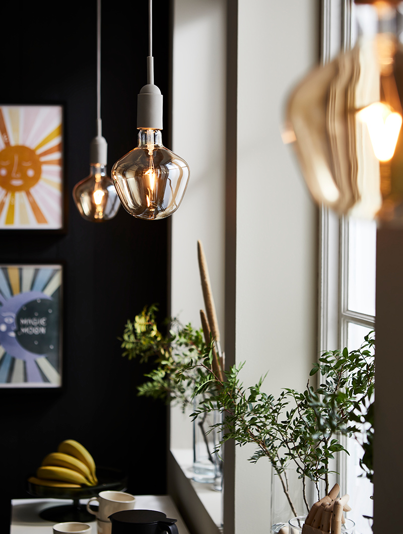 a cosy cafe atmosphere with multiple pendant lamps