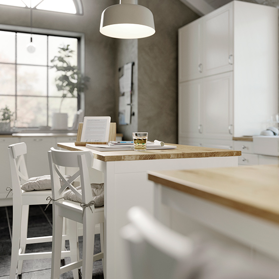 detail of a kitchen island with two high chairs in white color traditional elegant style