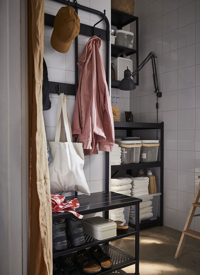 A storage room with ENHET shelving units, SAMLA boxes, a RISATORP wire basket, and FREDRIKSJÖN bath towels.