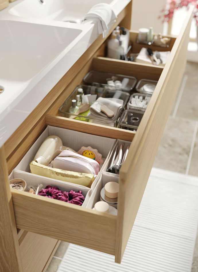 Bathroom cabinet drawer lower labavo, open and you can see different bathroom items