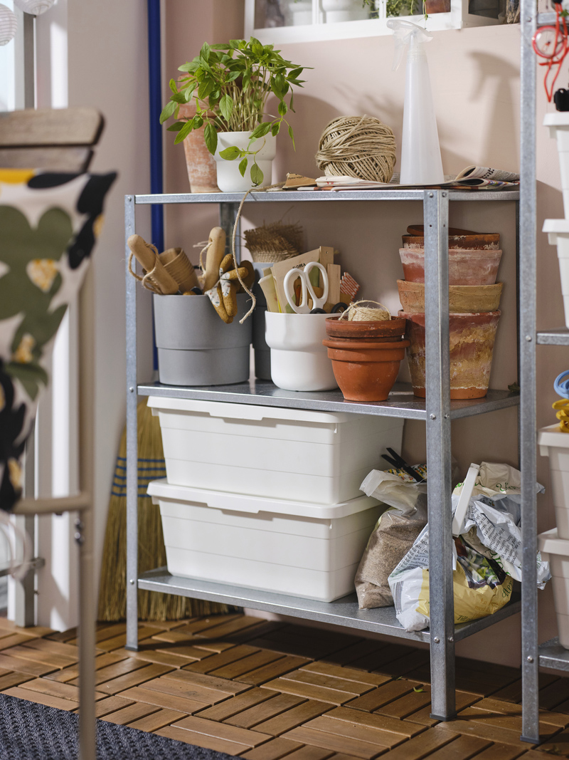 Use a sturdy and lightweight shelving unit to house your greenery