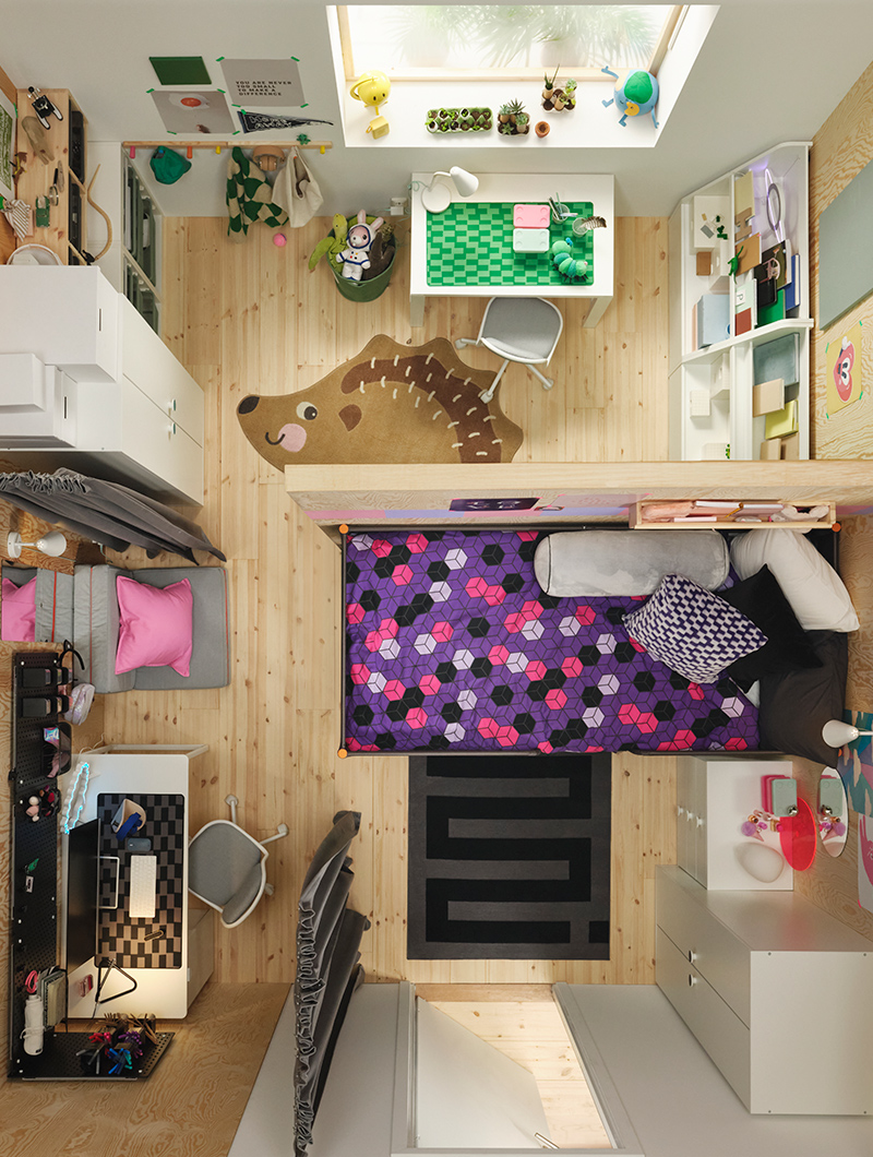 Aerial view of a children's bedroom with bunk beds, desks, and storage. Pastel tones and light wood create a playful and functional ambiance.