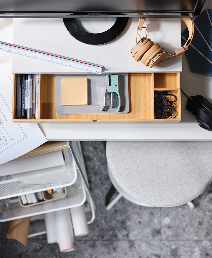 Top of a desk with an ELLOVEN monitor stand with drawer.