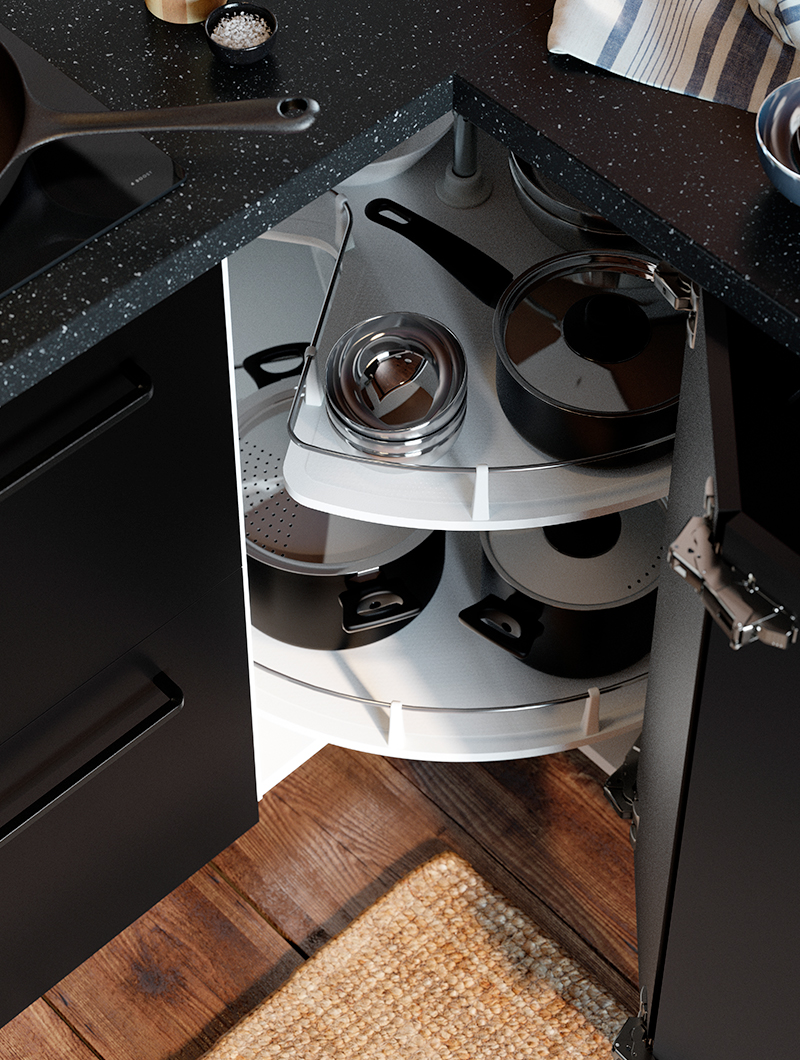 Un mueble de cocina de esquina oscuro con un carrusel blanco extraíble lleno de ollas y sartenes, maximizando el almacenamiento.