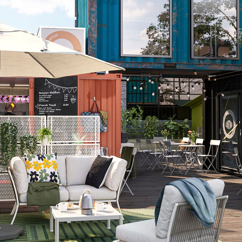 Container villa with café, restaurant and flower shop in a cozy, industrial style.