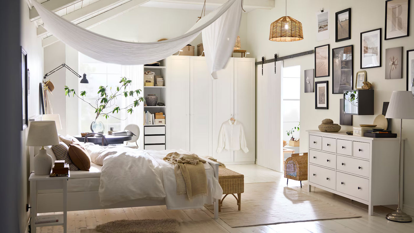 Scandinavian bedroom with cozy decor, warm lighting and minimalist furniture.