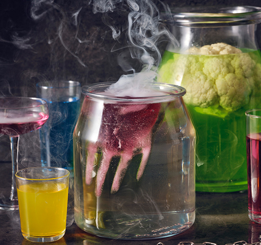 Halloween drinks featuring smoking jars, hand ice, and pickled cauliflower.