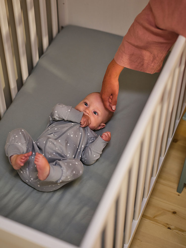 A baby in a crib