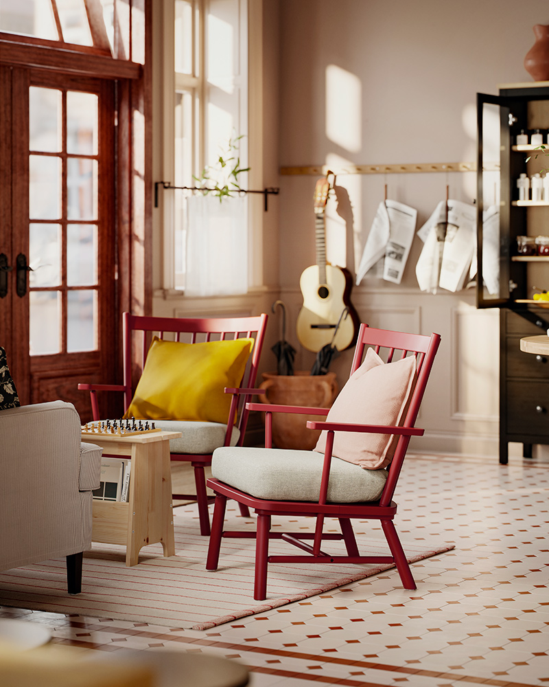 A tiled reception area has two brown-red PERSBOL spindle armchairs with beige-grey seat cushions, facing a table and sofa.